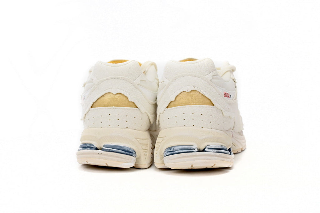 New Balance 2002R Women's & Men's Ivory Cream Distressed Retro Sneakers