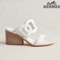 Hermès    female slides  White Calfskin Cutout Wedge Slide Sandals