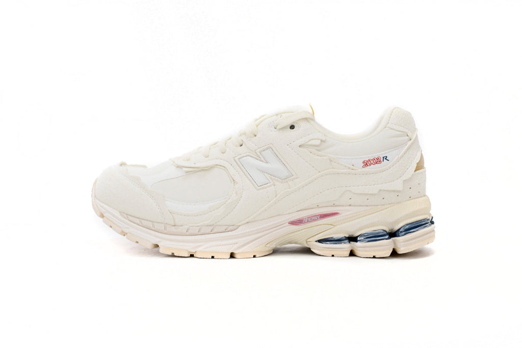 New Balance 2002R Women's & Men's Ivory Cream Distressed Retro Sneakers