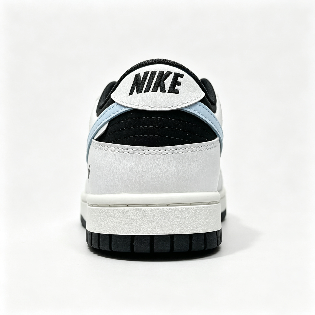 Nike Dunk Low 'Miracle' — Black & White with Light Blue Swoosh & Heel Print